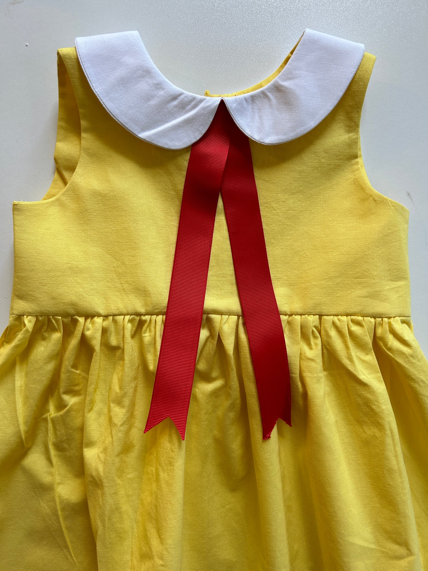 Little Yellow Dress with Red Ribbon