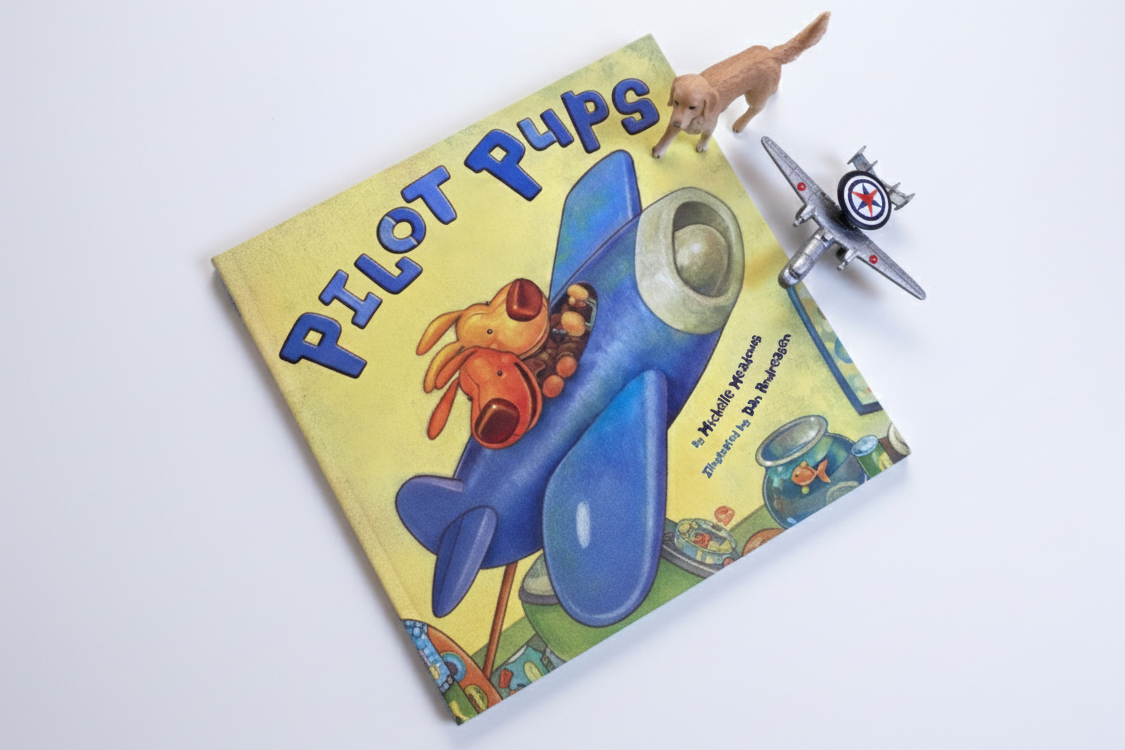 Children's book titled 'Pilot Pups' with a toy airplane on a white background