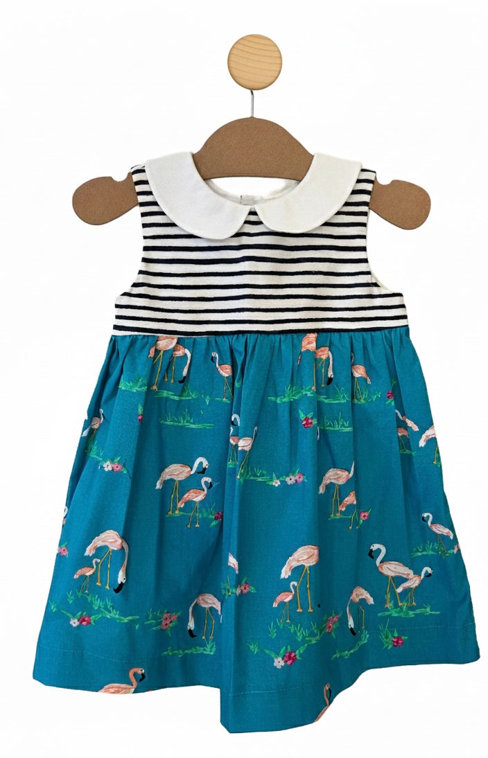 Little blue dress on a hanger slightly swaying