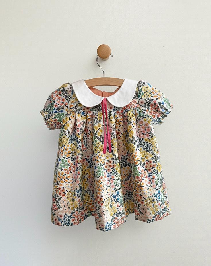 little wildflowers dress hanging on a hanger and swaying