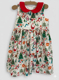 Children's Christmas-themed dress with Santa Claus and trees on a white background