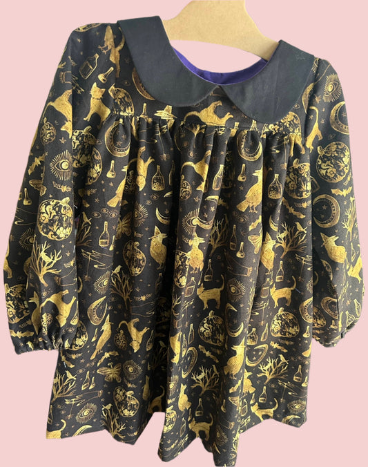 Black and gold witch print dress with black collar