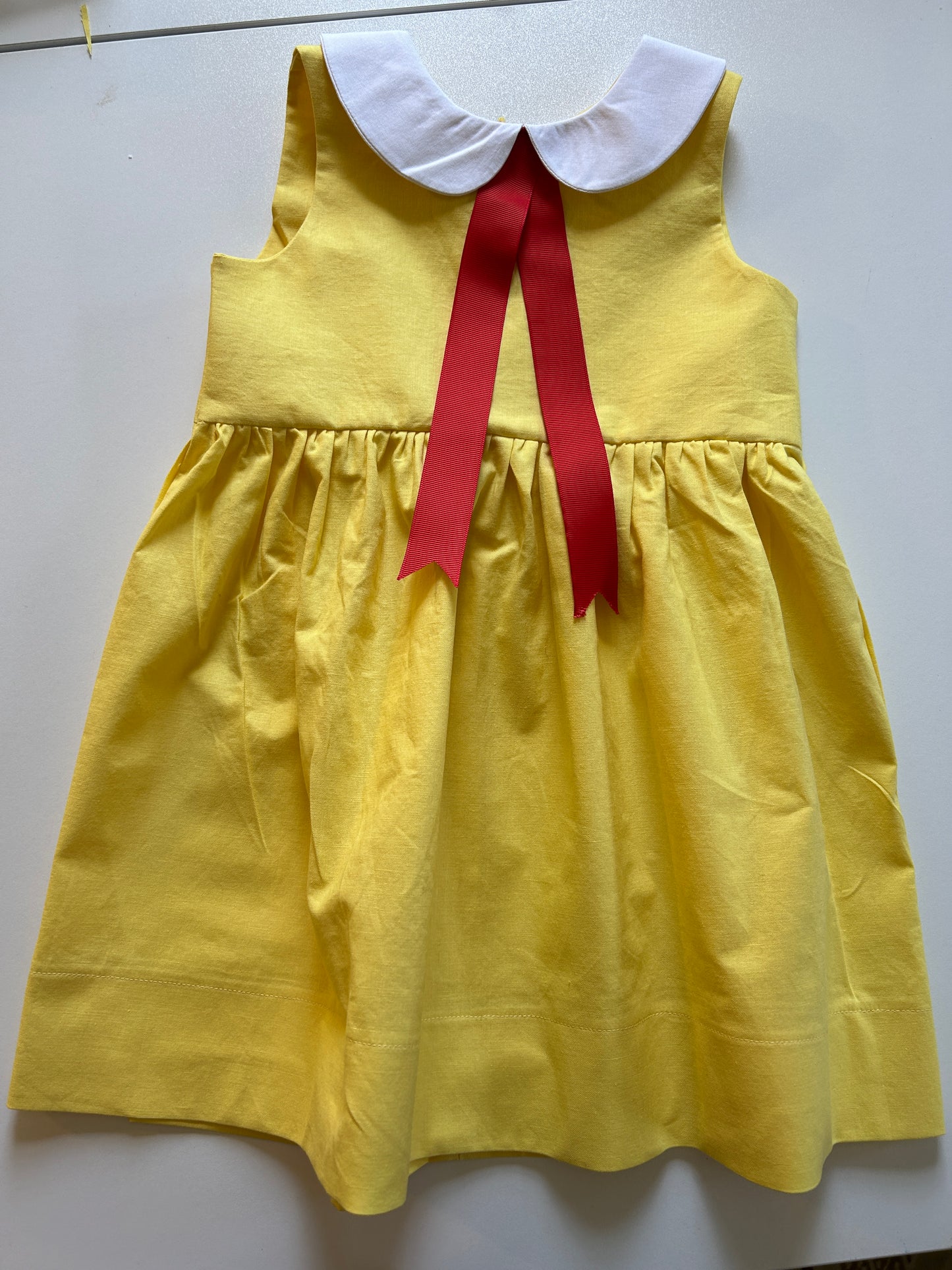 Little Yellow Dress with Red Ribbon