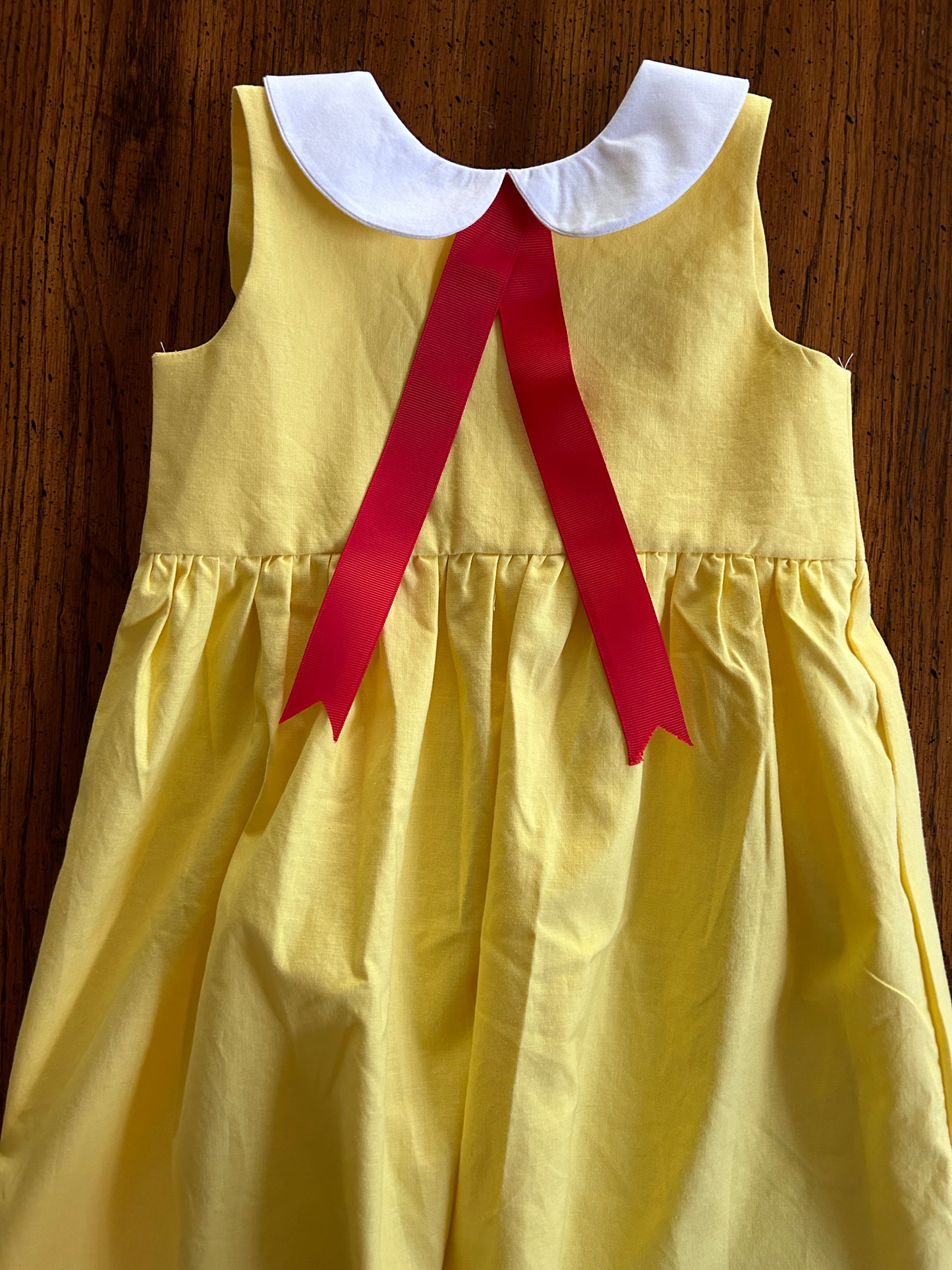 Little Yellow Dress with Red Ribbon