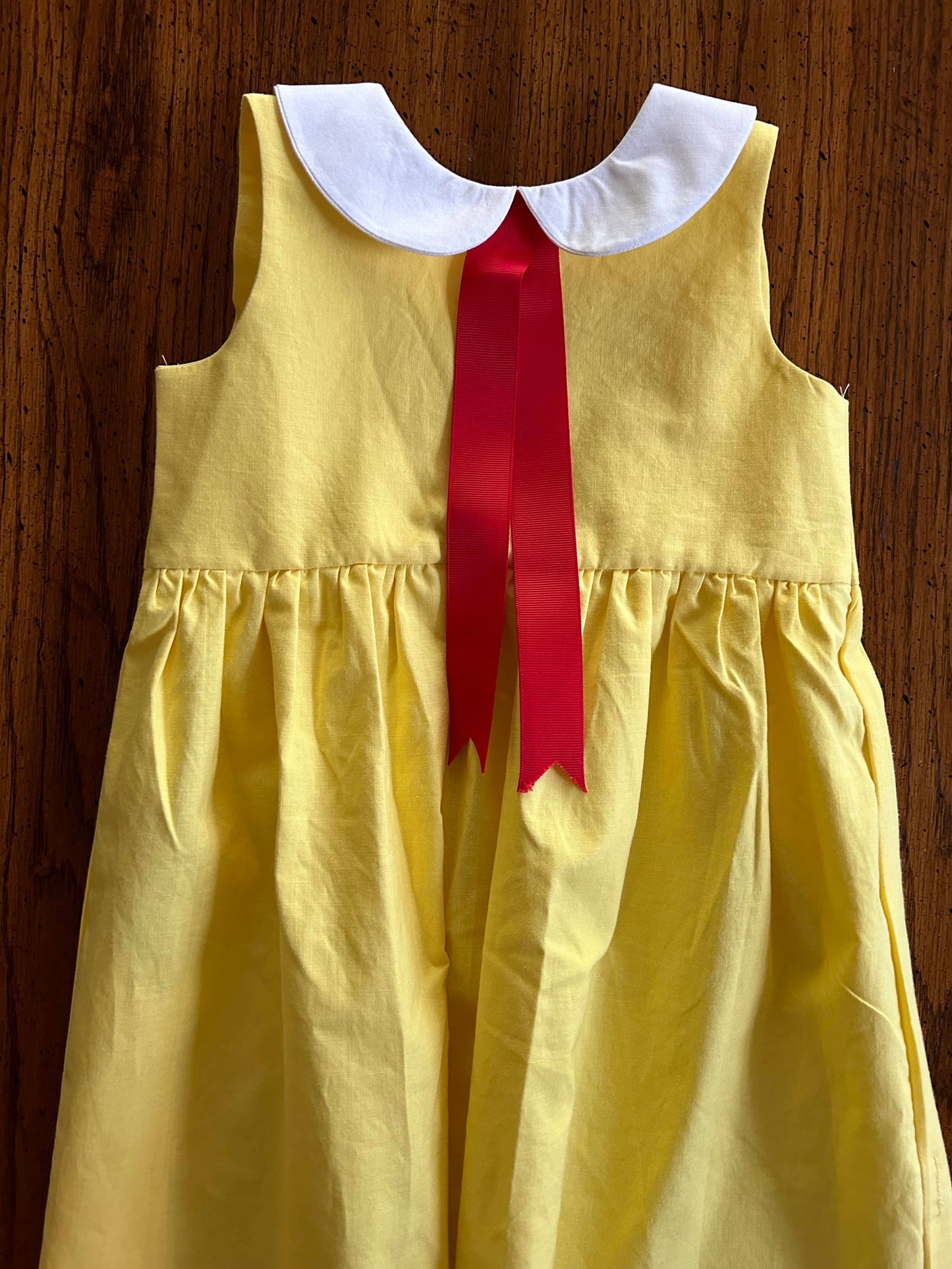 Little Yellow Dress with Red Ribbon